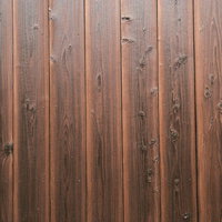 節目がボコボコした縦板の板壁のテクスチャーの写真