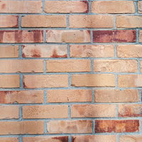 濃い色のレンガが混在する煉瓦壁のテクスチャーの写真