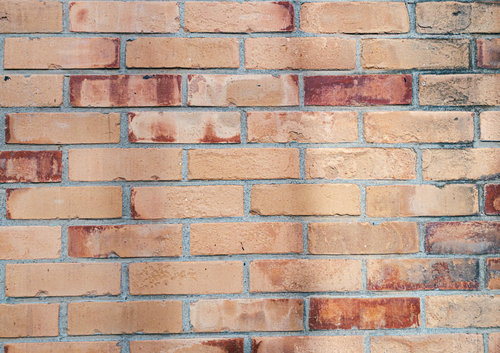 濃い色のレンガが混在する煉瓦壁のテクスチャー