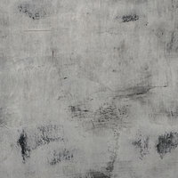 黒いシミと汚れがついたグレーのコンクリート壁の写真