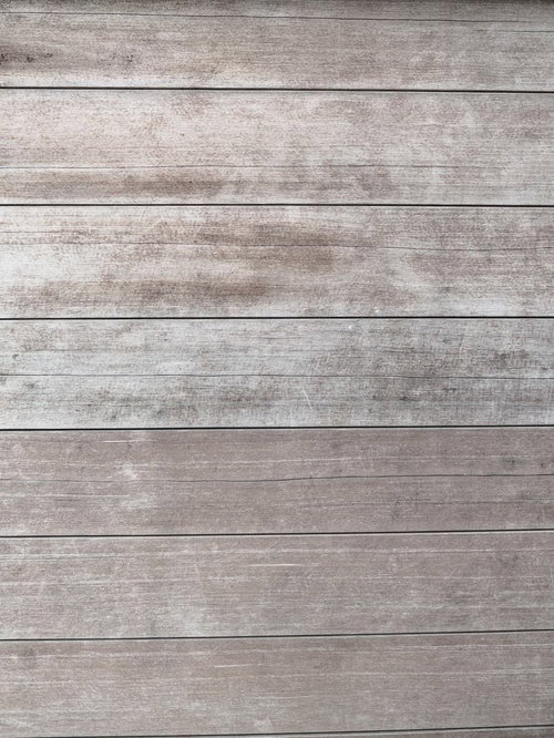 経年劣化で色褪せてきた板壁の木目テクスチャー