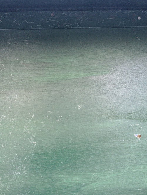 縦張りの緑色の板壁のテクスチャー