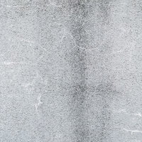 目立たないように補修されたひび割れのある壁（テクスチャ）の写真