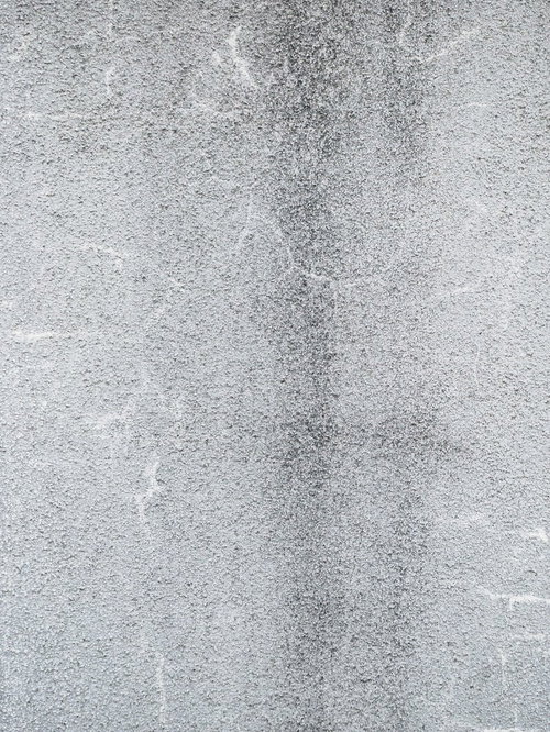 目立たないように補修されたひび割れのある壁（テクスチャ）