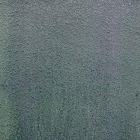 年季の入ったモルタル仕上げの外壁の写真