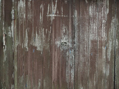 ペンキ剥げした板戸の古い木目テクスチャー