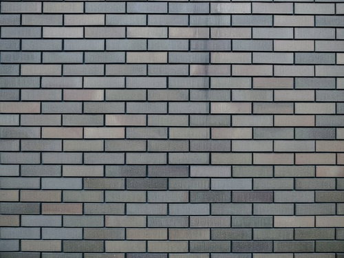 目地の深いグレーのレンガ調外壁のテクスチャー