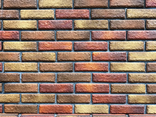 白い目地を入れたばかりの赤茶色レンガ壁のテクスチャー