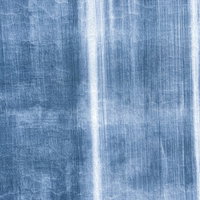 白色の縦線が入る青い外壁のテクスチャーの写真