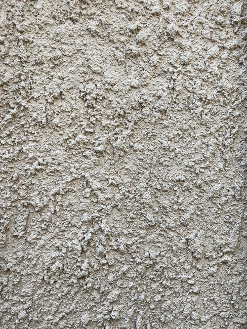 グレーのモルタル仕上げ外壁のテクスチャー