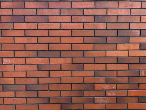 赤茶色のレンガタイル壁のテクスチャー