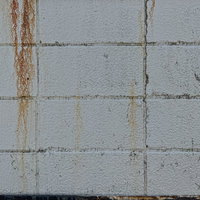 錆が垂れたブロック塀のテクスチャー写真の写真