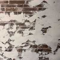 塗装が剥がれた古い外壁のテクスチャーの写真