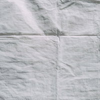 折りしわの付いた布切れのテクスチャー素材の写真