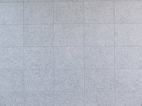 敷き詰められた真新しいグレー石材タイルのテクスチャー