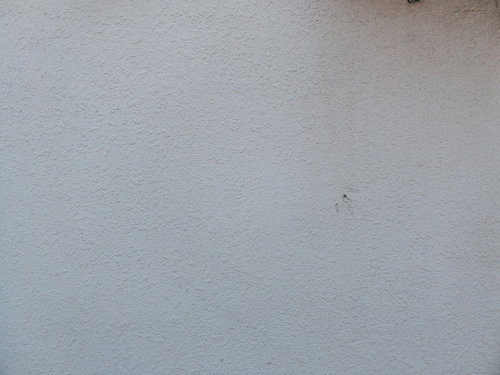 白いモルタル仕上げの外壁テクスチャー