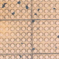 汚れた点状警告ブロックのテクスチャー表面の写真