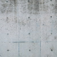 屋外の打ちっぱなしコンクリート壁のテクスチャーの写真