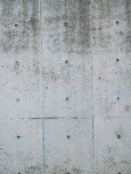 屋外の打ちっぱなしコンクリート壁のテクスチャー