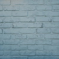 白く塗装されたレンガ壁のテクスチャーと質感の写真