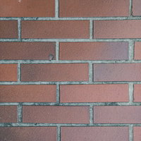 汚れたマンション外壁のレンガ風タイル（テクスチャー）の写真