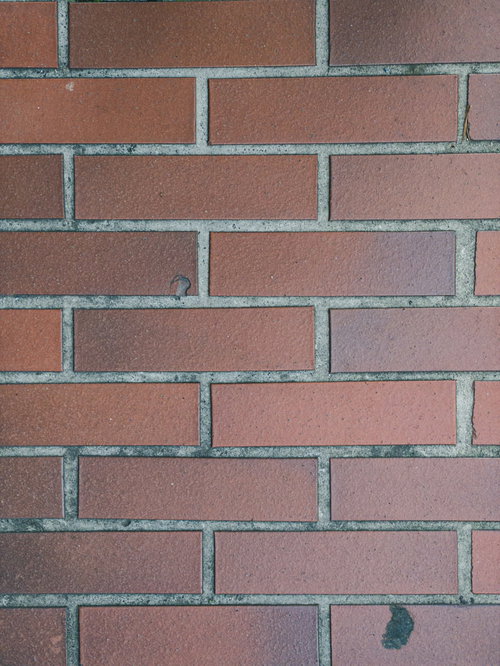 汚れたマンション外壁のレンガ風タイル（テクスチャー）