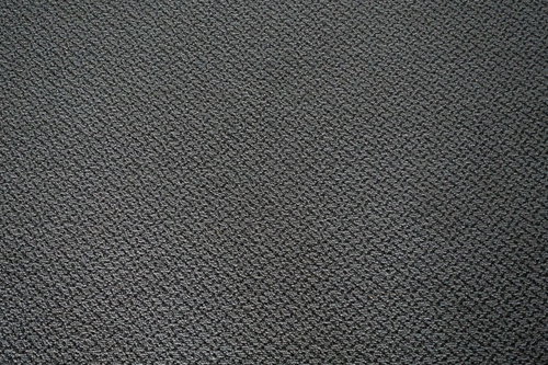 グレーのきめ細かい絨毯の縦断テクスチャー