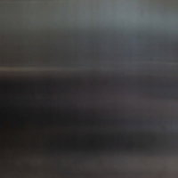 薄暗い空間に広がるグレーのテクスチャー背景の写真