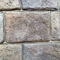 グレーの大きめな石タイルのテクスチャー 建築壁面の写真