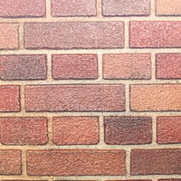 色合いや形が異なる赤レンガの壁。積み重ねられたレンガのテクスチャーの写真
