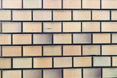 色褪せたパステルカラーのタイル壁のテクスチャー