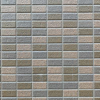 淡いグレーのカラータイルのテクスチャー壁面の写真