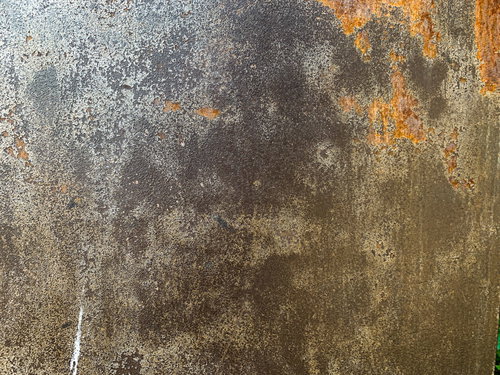 剥がれた塗装と錆び付いた鉄壁のテクスチャー