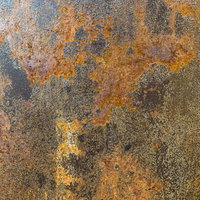 オレンジ色に錆び付いた鉄板のテクスチャーの写真