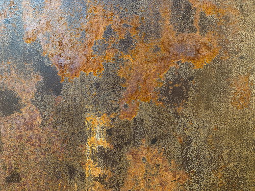 オレンジ色に錆び付いた鉄板のテクスチャー