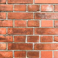 レンガに付いた黒ジミのテクスチャーの写真