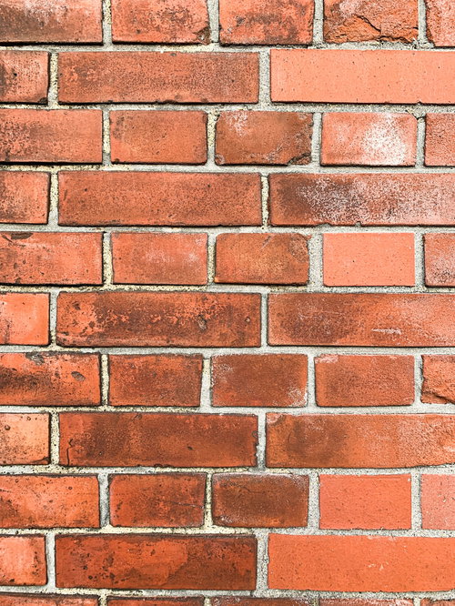 レンガに付いた黒ジミのテクスチャー