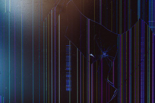 青と黒の縦縞パターンが浮かぶ画面が割れた液晶モニター