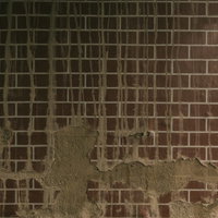 剥がれ落ちたタイルの壁のテクスチャの写真