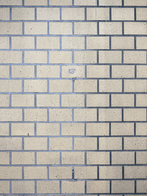 薄汚れた白とベージュのタイル壁のテクスチャー