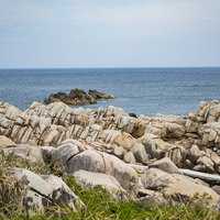 巨岩が連なる徳之島のムシロ瀬の海岸風景と花崗岩の絶景の写真