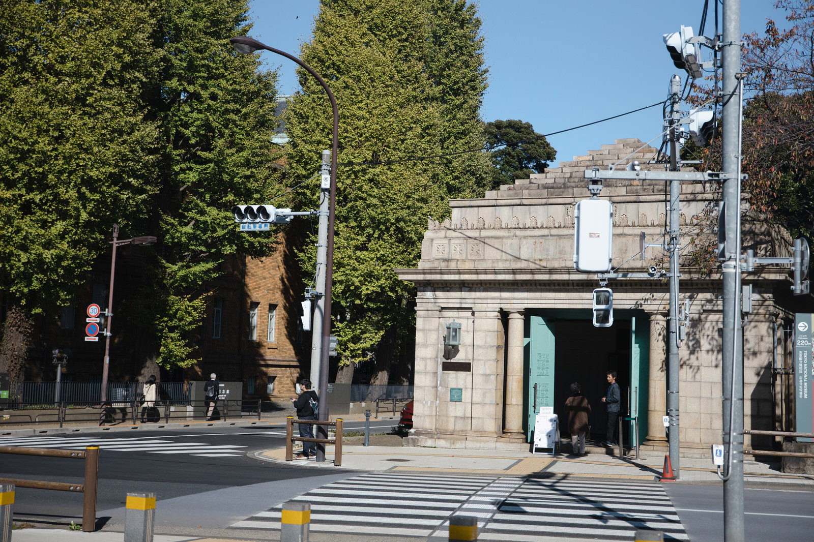 Open doors of the abandoned Museum and Zoo Station with crosswalk and surroundings