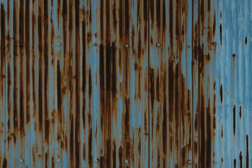 錆び付いた波板の古い金属テクスチャー