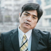 落胆して諦め顔の上司の様子の写真