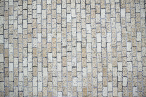 グレーの目地が印象的な白いタイル壁のテクスチャー