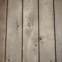 床に敷いた板の木目とフシのテクスチャーの写真