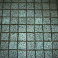 薄暗いグレー系タイルの床テクスチャーの写真