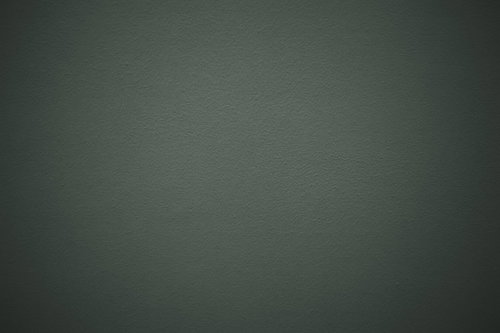 薄暗いグレーの壁面に見える質感のテクスチャー