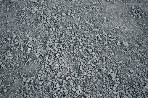 不揃いな小石が敷き詰められた地面のテクスチャー
