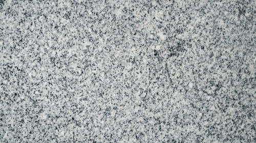 グレーと白の斑点模様が広がる大理石のような壁テクスチャー